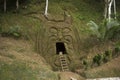 Cave entrance with traditional ornament near Banos, Ecuador.