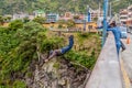 BANOS, ECUADOR - JUNE 20, 2015: People performing bridge jumping puenting on San Francisco Bridge in Bano