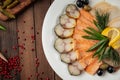 Assorted smoked fish platter on wooden background Royalty Free Stock Photo