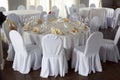 Banquet hall chairs, white tablecloth, food table, table setting, empty wine glasses, Banquet hall without people Royalty Free Stock Photo