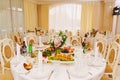 Banquet hall of the restaurant with served tables.