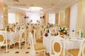 Banquet hall of the restaurant with served tables.