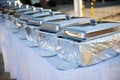 Banquet table with chafing dishes Royalty Free Stock Photo