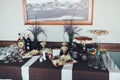 Banquet table with different snacks and alcohol