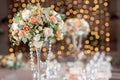Focus on glasses. Banquet table in the restaurant, the preparation before the banquet. the work of professional florists Royalty Free Stock Photo