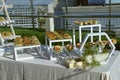 Banquet table served for party snack cakes, eclairs, charlottes. restaurant on a roof of building