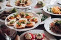 Banquet table served with various cold snacks and salads. Royalty Free Stock Photo