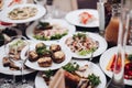 Banquet table served with various cold snacks and salads. Royalty Free Stock Photo