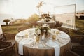 Banquet tables on seashore at sunset Royalty Free Stock Photo