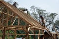 Baduy people work together to build their traditional houses.