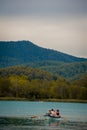 BANYOLES, SPAIN - AUGUST 7 2021: A family on a boat cruise on Lake Banyoles