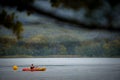 BANYOLES, SPAIN - AUGUST 7 2021: Man canoeing on the Spanish lake Banyoles Royalty Free Stock Photo