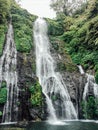 Banyumala waterfall in North Bali island, Indonesia. Jungle waterfall cascade in tropical rainforest with rock and turquoise blue Royalty Free Stock Photo