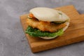 Bao buns. Hawaiian dish on a wooden table. Pan-Asian cuisine concept. Close-up