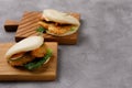 Bao buns. Hawaiian dish on a wooden table. Pan-Asian cuisine concept. Close-up