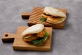 Bao buns. Hawaiian dish on a wooden table. Pan-Asian cuisine concept. Close-up