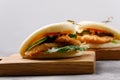 Bao buns. Hawaiian dish on a wooden table. Pan-Asian cuisine concept. Close-up