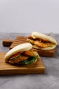 Bao buns. Hawaiian dish on a wooden table. Pan-Asian cuisine concept. Close-up