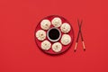 Baozi dumplings on a red plate with soy sauce. Steamed bao dumplings, flat lay Royalty Free Stock Photo