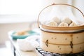 baozi steamed buns in a steamer basket