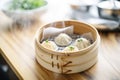 baozi steamed buns in a steamer basket