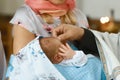 Baptism ceremony in Church, sanctification by the priest`s hand on the head. set Royalty Free Stock Photo