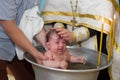 Baptism of a child. Ablution in holy water. Accepting faith. Orthodox baptism Royalty Free Stock Photo