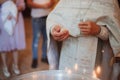 baptism of a child in the church, preparation of the ceremony, cross, holy water Royalty Free Stock Photo