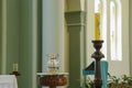 Baptism rite - baptismal font, water jug and paschal candle