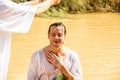 Baptism in a river of Jordan, Israel Royalty Free Stock Photo