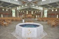 Baptismal font in catholic church Royalty Free Stock Photo