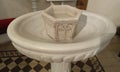 A baptismal font with holy water Royalty Free Stock Photo