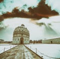 Baptistery of Pisa after a winter snowfall at sunset. Square of
