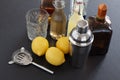 Bar accessories seen from above. Drink tools and cocktail ingredients including shaker, strainer, glass, liqueur, homemade syrup b Royalty Free Stock Photo