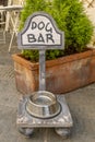 A bar that also has a dog area with a bowl full of water in the city center of Montecarlo, Lucca, Italy Royalty Free Stock Photo