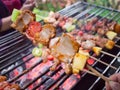 Bar-B-Q or BBQ with kebab cooking. coal grill of pock meat skewers with pineapple and green pepper. barbecuing dinner.