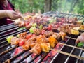 Bar-B-Q or BBQ with kebab cooking. coal grill of pock meat skewers with pineapple and green pepper. barbecuing dinner. Royalty Free Stock Photo