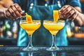 At the bar, a bartender prepares a cocktail using a glass and a lemon peel Royalty Free Stock Photo