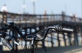 Bar of a bycicle parked in front of Newport Beach Pier Royalty Free Stock Photo