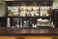 Bar counter with alcohol bottles assortment Royalty Free Stock Photo