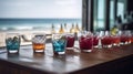 Bar counter on the beach. Glasses with cocktails, sun glasses lie on the table. Concept of relaxing, preparation and summer, AI Royalty Free Stock Photo