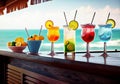 Bar counter on the beach. Glasses with cocktails lie on the table. Concept of relaxing, summer vacation. Generative AI. Royalty Free Stock Photo