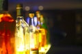 Bar counter with bottles in blurred background Royalty Free Stock Photo