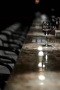 Bar counter, chairs, glass of wine