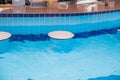 Bar counter in the pool with clear water chairs Royalty Free Stock Photo