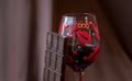 Bar of dark chocolate and a glass of red wine Royalty Free Stock Photo