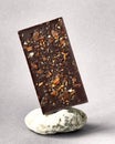 Bar of dark chocolate on stone gray background. Side view. Place for text Royalty Free Stock Photo