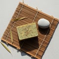 Bar of handmade soap rests on Royalty Free Stock Photo