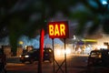 Bar light sign board in red color, neon sign for a bar,Bar neon sign,neon BAR sign lights up the doorway of a drinking