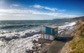 The bar on a mediterranen beach with rough sea in a sunny day, Italy. Royalty Free Stock Photo